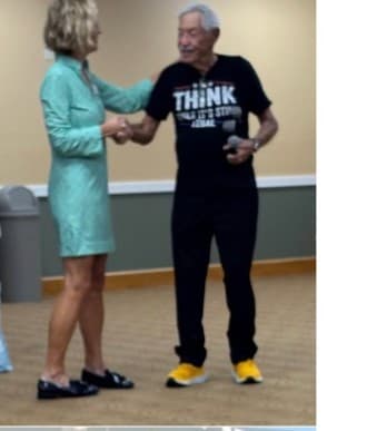 Victoria Doyle greeting a supporter at a community event