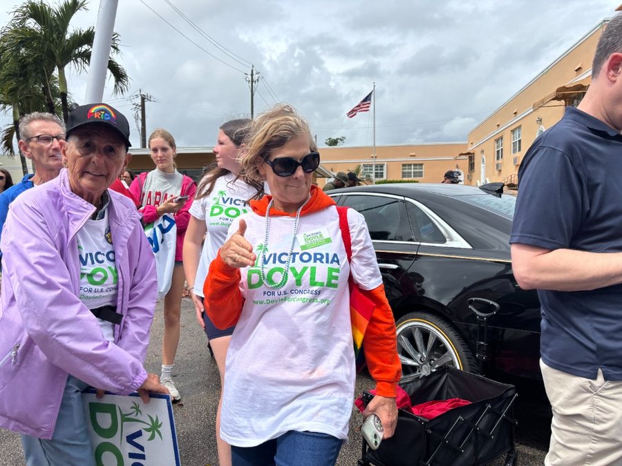 Victoria Doyle with campaign supporters wearing Doyle for Congress shirts