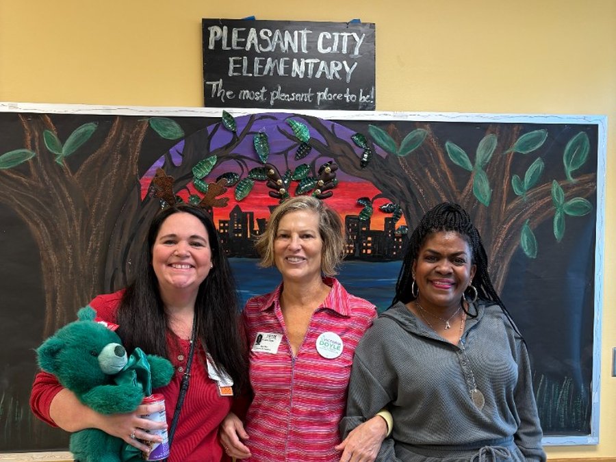 Victoria Doyle with staff at Pleasant City Elementary School