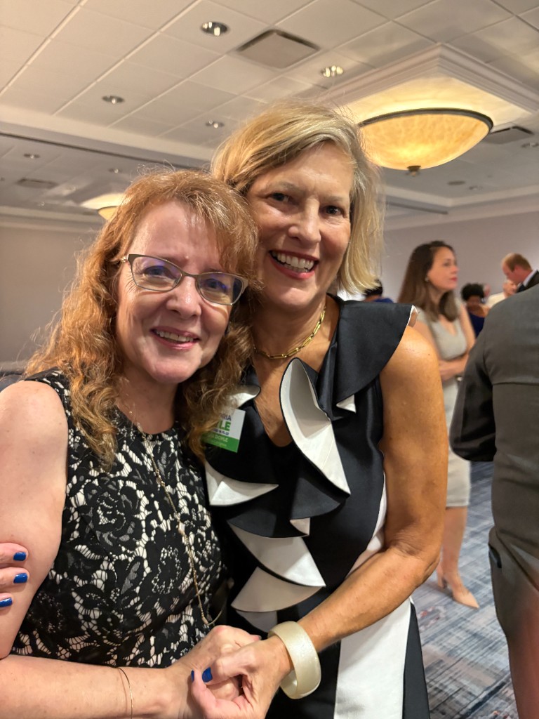 Victoria Doyle with Dr. Karen Leader at a community event