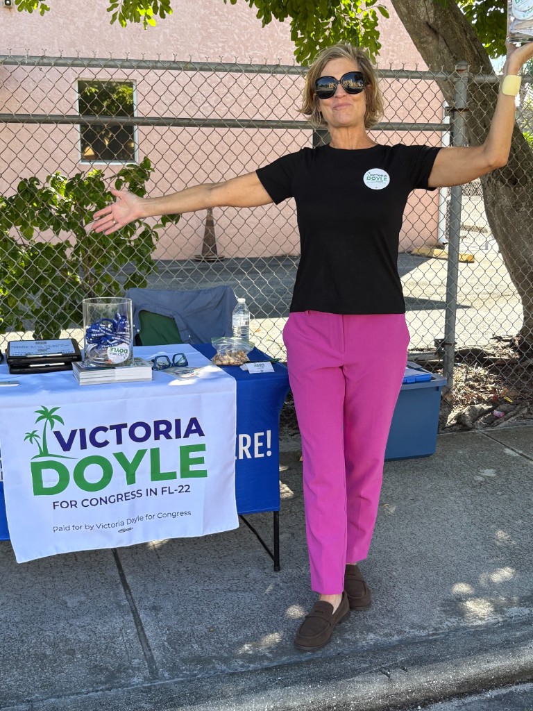 Victoria Doyle registering voters in Pleasant City with community members