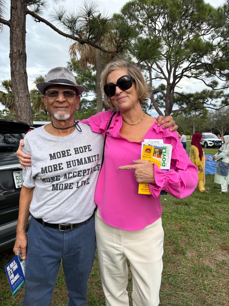 Victoria Doyle with a supporter at a community event in Palm Beach County