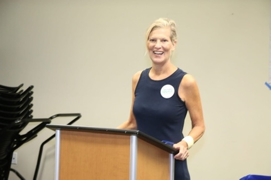 Victoria Doyle speaking at a community forum in Greenacres